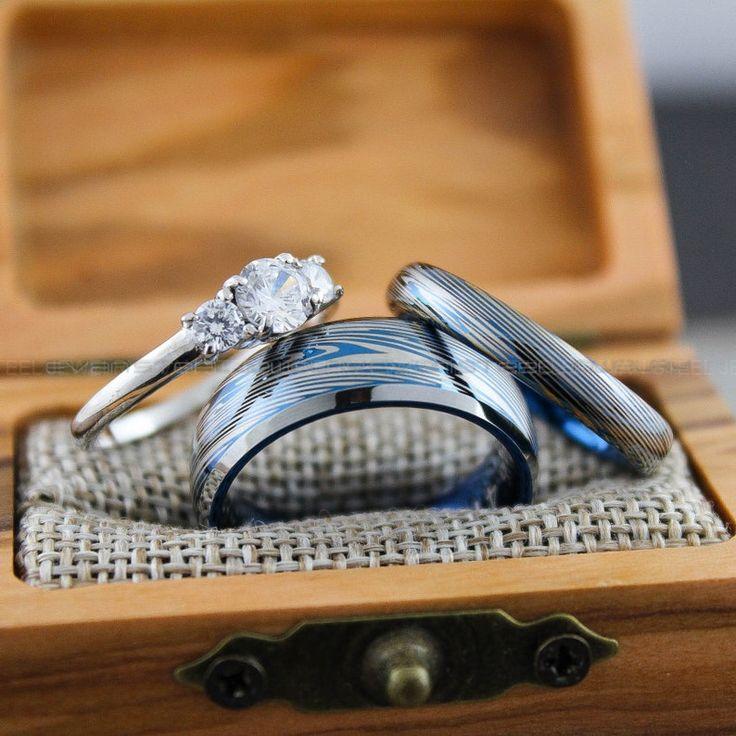 eef9f1f9a532856ccf0f77a5b7ef243c Damascus Steel Rings, Damascus Steel Wedding Rings, 3 Piece Couple Set Blue Tungsten Bands .925 Sterling Silver Three Stone Engagement Ring - Image 1